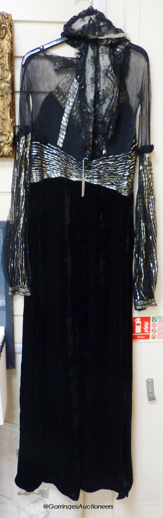 A late 1930's black silk velvet and silver evening dress and an Edwardian black sequin triangular shawl